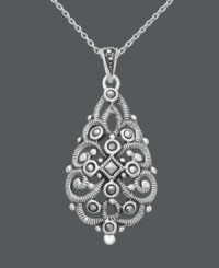 Flawless in filigree. Genevieve & Grace design makes a remarkable statement with a breathtaking filigree pattern accented by glittering marcasite in sterling silver. Approximate length: 18 inches. Approximate drop: 1-1/2 inches. Flawless in filigree. Genevieve & Grace design makes a remarkable statement with a breathtaking filigree pattern accented by glittering marcasite in sterling silver. Approximate length: 18 inches. Approximate drop: 1-1/2 inches.