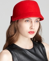 With a retro silhouette and structured back bow, this red cap from kate spade new york is stylish yet functional. With a retro silhouette and structured back bow, this red cap from kate spade new york is stylish yet functional.