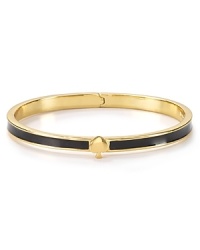 Simply styled, this bangle is just the bright touch, detailed with kate spade new york's signature. Simply styled, this bangle is just the bright touch, detailed with kate spade new york's signature.