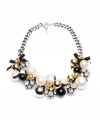 Start a conversation with this bold statement piece. Necklace by Betsey Johnson flaunts sparkly fireballs, acrylic pearls, black beads, ribbons, and crystal-accented rosebuds simultaneously. Crafted in antique gold and silver tone mixed metal. Approximate length: 20 inches.