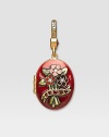 Garnet-colored CRYSTALLIZED - Swarovski Elements sparkle on this handcrafted, hand-enameled birthstone locket that opens to hold a favorite photo. Crystal Enamel 18k goldplated brass & brass-plated pewter Month indicated on the back Length, about 1¼ Width, about 1 Spring clip clasp Made in USA