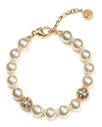 This Majorica pearl bracelet is decorated with sparkling gold-tone ball stations. For a special occasion, make this the finishing touch to accent your ensemble. This Majorica pearl bracelet is decorated with sparkling gold-tone ball stations. For a special occasion, make this the finishing touch to accent your ensemble.