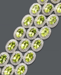 Make others green with envy in this sparkling peridot piece. Bracelet features three luminous rows of oval-cut peridot (31 ct. t.w.) surrounded by an intricate hammered setting. Crafted in sterling silver. Approximate length: 7-1/2 inches. Make others green with envy in this sparkling peridot piece. Bracelet features three luminous rows of oval-cut peridot (31 ct. t.w.) surrounded by an intricate hammered setting. Crafted in sterling silver. Approximate length: 7-1/2 inches.