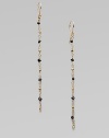 A delicate style consisting of beautiful rough black diamonds and radiant 14k gold beads. Rough black diamonds14k goldDrop, about 3French hookMade in USA 