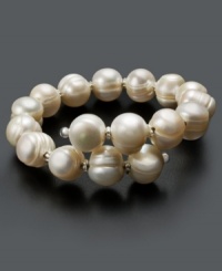 Wrap a layer of elegance around your wrist. This sophisticated bracelet features cultured freshwater pearls (10-11 mm) in a sterling silver setting. Approximate diameter: 3 inches. Wrap a layer of elegance around your wrist. This sophisticated bracelet features cultured freshwater pearls (10-11 mm) in a sterling silver setting. Approximate diameter: 3 inches.