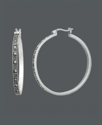 A stylish spin on the traditional hoop. A sterling silver click setting highlights glittering marcasite in these standout Genevieve & Grace hoop earrings. Approximate diameter: 1-1/4 inches. A stylish spin on the traditional hoop. A sterling silver click setting highlights glittering marcasite in these standout Genevieve & Grace hoop earrings. Approximate diameter: 1-1/4 inches.