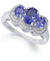 A true beauty. This stunning ring features three oval-cut tanzanite stones (1-1/4 ct. t.w.) surrounded by halos of round-cut diamond accents. Set in sterling silver. Size 7.