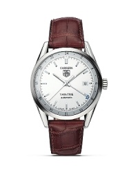 TAG Heuer's Carrera series is inspired by motoracing. The sleek, classic design of this watch is ideal for today's lifestyles. The Twin Time watch features a second time zone function, a steel case and brown alligator strap. TAG Heuer's Carrera series is inspired by motoracing. The sleek, classic design of this watch is ideal for today's lifestyles. The Twin Time watch features a second time zone function, a steel case and brown alligator strap.