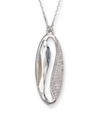 Make a statement of harmony and purity. Swarovski's silver tone mixed metal pendant is inspired by the Yin and Yang. The lightness of the large faceted azure Swarovski crystal contrasts with the clear crystals in a pavé setting, providing a harmonious mix of glitter and gleam. Approximate length: 19 inches. Approximate drop: 1-1/4 inches. Make a statement of harmony and purity. Swarovski's silver tone mixed metal pendant is inspired by the Yin and Yang. The lightness of the large faceted azure Swarovski crystal contrasts with the clear crystals in a pavé setting, providing a harmonious mix of glitter and gleam. Approximate length: 19 inches. Approximate drop: 1-1/4 inches.