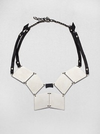 Like a work of modern sculpture, pewter-color triangular shapes and leather straps are worked into a visionary necklace that's anything but ordinary.Pewter-plated and hematite-plated brassLeatherLength, about 19 (adjustable)Lobster claspMade in USA Like a work of modern sculpture, pewter-color triangular shapes and leather straps are worked into a visionary necklace that's anything but ordinary.Pewter-plated and hematite-plated brassLeatherLength, about 19 (adjustable)Lobster claspMade in USA