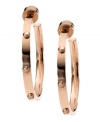 Bring some edge to a timeless look. Michael Kors added stud detail to a classic metal hoop earring. Crafted in rose gold tone mixed metal. Approximate diameter: 1 inches.