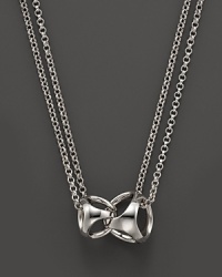 This sterling silver pendant represents the love between a mother and her child. By Di MODOLO. This sterling silver pendant represents the love between a mother and her child. By Di MODOLO.