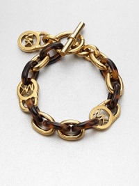 An eye-catching piece with tortoise-pattern acetate links, goldtone links and goldtone logo lock links. Tortoise-pattern acetateGoldtone brassLength, about 8Toggle closureImported An eye-catching piece with tortoise-pattern acetate links, goldtone links and goldtone logo lock links. Tortoise-pattern acetateGoldtone brassLength, about 8Toggle closureImported