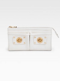 Supple leather design with turn-lock detail for a cute and classic look.Top zip closure Two outside open pockets One inside zip pocket One inside open pocket Six inside credit card slots Cotton lining 8W X 4H X ½D Imported Comes with a Marc by Marc Jacobs signature gift box Supple leather design with turn-lock detail for a cute and classic look.Top zip closure Two outside open pockets One inside zip pocket One inside open pocket Six inside credit card slots Cotton lining 8W X 4H X ½D Imported Comes with a Marc by Marc Jacobs signature gift box