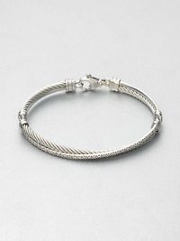 From the Crossover Collection. Iconic cable accented with a ring of pavé diamonds in an intriguing crossover design. Sterling silverDiamonds, .49 tcwDiameter, about 2.5Hinged, lobster clasp closureImported From the Crossover Collection. Iconic cable accented with a ring of pavé diamonds in an intriguing crossover design. Sterling silverDiamonds, .49 tcwDiameter, about 2.5Hinged, lobster clasp closureImported
