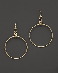 Delicate horsebits top gleaming 18K yellow gold hoops from Gucci. Delicate horsebits top gleaming 18K yellow gold hoops from Gucci.