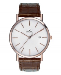 A clean, traditional timepiece from Bulova. Brown croc-embossed leather strap and rose-colored stainless steel case. Minimalist white dial with logo and thin rose-colored indexes and indicators. Three hands. Quartz movement. Water resistant to 30 meters. Three-year limited warranty. A clean, traditional timepiece from Bulova. Brown croc-embossed leather strap and rose-colored stainless steel case. Minimalist white dial with logo and thin rose-colored indexes and indicators. Three hands. Quartz movement. Water resistant to 30 meters. Three-year limited warranty.