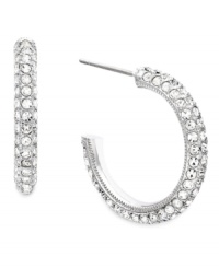 Shine from the inside out! Eliot Danori's shimmery three-quarter hoops feature a micro pave-set crystal design in silver tone mixed metal. Approximate diameter: 3/4 inch. Shine from the inside out! Eliot Danori's shimmery three-quarter hoops feature a micro pave-set crystal design in silver tone mixed metal. Approximate diameter: 3/4 inch.
