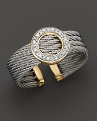 A yellow gold and stainless steel round ring with diamonds. Designed by Charriol. A yellow gold and stainless steel round ring with diamonds. Designed by Charriol.