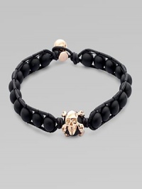 A modern array of black onyx beads are framed by leather detail and finished with a rose gold skull. OnyxLeatherRose goldLength, about 9Diameter, about 3 Clasp closureImported A modern array of black onyx beads are framed by leather detail and finished with a rose gold skull. OnyxLeatherRose goldLength, about 9Diameter, about 3 Clasp closureImported