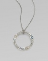 From the Confetti Collection. A wreath-shaped cable pendant, luxuriously set with pavé diamonds and other gemstones, dangles from a sterling silver chain. Diamonds, 0.05 tcw Blue topaz and iolite Sterling silver Chain length, about 16 Pendant diameter, about 1 Lobster clasp Made in USA
