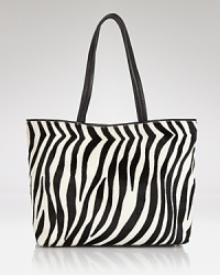 This perennially polished DKNY carryall gets wild in spot-splashed calf hair with luxe leather trim. Elegantly on-trend, let this beauty be the basis of your next fashion moment. This perennially polished DKNY carryall gets wild in spot-splashed calf hair with luxe leather trim. Elegantly on-trend, let this beauty be the basis of your next fashion moment.