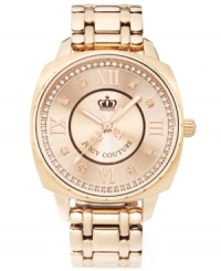 Boisterous glam in a compact design: a stunning timepiece brought to you by Juicy Couture. Beau collection watch by Juicy Couture crafted of rose-gold tone stainless steel bracelet and round case. Rose-gold tone sunray dial crystallized with ring of Swarovski elements features textured inner dial, applied Roman numerals at twelve, three, six and nine o'clock, crystal markers, three hands, text logo and crown logo. Quartz movement. Water resistant to 30 meters. Two-year limited warranty. Boisterous glam in a compact design: a stunning timepiece brought to you by Juicy Couture. Beau collection watch by Juicy Couture crafted of rose-gold tone stainless steel bracelet and round case. Rose-gold tone sunray dial crystallized with ring of Swarovski elements features textured inner dial, applied Roman numerals at twelve, three, six and nine o'clock, crystal markers, three hands, text logo and crown logo. Quartz movement. Water resistant to 30 meters. Two-year limited warranty.
