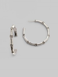 From the Nusa Penida Collection. Simple bamboo-shaped hoops crafted of fine sterling silver. This design was expressly created to support an afforestation project on Nusa Penida, an arid island off the coast of Bali. John Hardy will donate a portion of each purchase to the cost of planting bamboo. This earring will support the planting of 9 bamboos, which is inscribed inside the earring. Sterling silver Diameter, about 1¼ Post back Made in Bali From the Nusa Penida Collection. Simple bamboo-shaped hoops crafted of fine sterling silver. This design was expressly created to support an afforestation project on Nusa Penida, an arid island off the coast of Bali. John Hardy will donate a portion of each purchase to the cost of planting bamboo. This earring will support the planting of 9 bamboos, which is inscribed inside the earring. Sterling silver Diameter, about 1¼ Post back Made in Bali