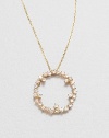 Sparkling white sapphires set in 14k gold with a open circle design on a delicate link chain. White sapphire14k goldLength, about 16Pendant size, about .6 Spring ring closureMade in USA