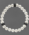 Slip a little elegance over your wrist. Kaleidoscope's pretty bracelet features a mix of cultured freshwater pearls (8 mm) and sparkling stations made from black crystals with Swarovski Elements. Bracelet stretches to fit wrist. Approximate length: 7-1/2 inches.