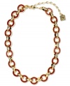 Link together haute fashion. This chunky collar necklace from Anne Klein flaunts red enamel links for a bold look. Crafted in gold tone mixed metal. Approximate length: 16 inches + 3-inch extender.