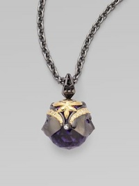 Dueling faces of goldplated and black rhodium plated sterling silver, complete with pavé cubic zirconia, enrapture a blue violet crystal, strung on a long elegant chain.Blue violet crystal Cubic zirconia Goldplated sterling silver Black rhodium plated sterling silver Chain length, about 30 Pendant width, about 1½ Lobster clasp Imported Dueling faces of goldplated and black rhodium plated sterling silver, complete with pavé cubic zirconia, enrapture a blue violet crystal, strung on a long elegant chain.Blue violet crystal Cubic zirconia Goldplated sterling silver Black rhodium plated sterling silver Chain length, about 30 Pendant width, about 1½ Lobster clasp Imported