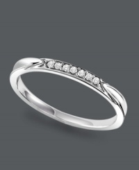 Sublime and subtle. The perfect complement to your diamond engagement ring, this simple wedding band shines with the addition of round-cut diamond accents. Crafted in sterling silver. Sizes 5-8. Sublime and subtle. The perfect complement to your diamond engagement ring, this simple wedding band shines with the addition of round-cut diamond accents. Crafted in sterling silver. Sizes 5-8.