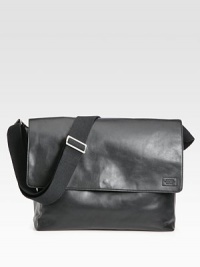 A stylish leather messenger bag to hold your every file and gadget.Flap-top snap closureAdjustable shoulder strapExterior slit pocketInterior laptop compartment with snap closureLeatherCotton lining14½W X 11H X 5½DImported A stylish leather messenger bag to hold your every file and gadget.Flap-top snap closureAdjustable shoulder strapExterior slit pocketInterior laptop compartment with snap closureLeatherCotton lining14½W X 11H X 5½DImported
