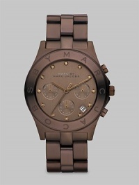 A lovely, chocolate-colored chronograph that features crystal markers and a signature bezel. Quartz movementWater resistant to 5 ATMRound brown plated stainless steel case, 40mm (1.6)Logo etched bezelBrown chronograph dialSmoked topaz markersDate function between 4 & 5 o'clockSecond hand Brown plated stainless steel link braceletImported A lovely, chocolate-colored chronograph that features crystal markers and a signature bezel. Quartz movementWater resistant to 5 ATMRound brown plated stainless steel case, 40mm (1.6)Logo etched bezelBrown chronograph dialSmoked topaz markersDate function between 4 & 5 o'clockSecond hand Brown plated stainless steel link braceletImported