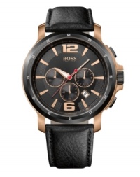 A hint of rosy tones grace the rich features of this precise timepiece made for the modern man, by Hugo Boss. Watch crafted of black leather strap and round rose-gold tone stainless steel case. Black bezel features engraved white numerals. Black chronograph dial features rose-gold tone applied numerals at twelve and six o'clock, stick indices, minute track, date window, three subdials, luminous hour and minute hands, red second hand and logo at twelve o'clock. Quartz movement. Water resistant to 100 meters. Two-year limited warranty. A hint of rosy tones grace the rich features of this precise timepiece made for the modern man, by Hugo Boss. Watch crafted of black leather strap and round rose-gold tone stainless steel case. Black bezel features engraved white numerals. Black chronograph dial features rose-gold tone applied numerals at twelve and six o'clock, stick indices, minute track, date window, three subdials, luminous hour and minute hands, red second hand and logo at twelve o'clock. Quartz movement. Water resistant to 100 meters. Two-year limited warranty.