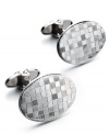 The perfect gift for the sophisticated business man. These sleek oval-shaped cuff links feature a unique checkered design in sterling silver. Approximate length: 1-7/8 inches. Approximate width: 5/8 inch.