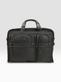 A slim, organized brief case for large screen laptops (up to 17). Separate cushioned laptop compartment Removable accessory pouch Interior pockets and elastic organizer panel Carry handles and removable, adjustable shoulder strap Add-a-bag sleeve for attaching to other cases Tumi Tracer Protection Ballistic nylon 13½H X 17½W X 3½D Imported A slim, organized brief case for large screen laptops (up to 17). Separate cushioned laptop compartment Removable accessory pouch Interior pockets and elastic organizer panel Carry handles and removable, adjustable shoulder strap Add-a-bag sleeve for attaching to other cases Tumi Tracer Protection Ballistic nylon 13½H X 17½W X 3½D Imported