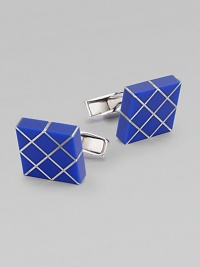 Elegant links with gleaming rhodium plating with inlaid lapis.Rhodium-plated sterling silverLapisAbout ½ diam.Made in the United Kingdom Elegant links with gleaming rhodium plating with inlaid lapis.Rhodium-plated sterling silverLapisAbout ½ diam.Made in the United Kingdom