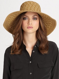This dramatic, packable straw topper features signature logo rivets, elasticized inner band and an oversized, sloped brim for maximum sun protection and style.Brim, about 4.75Elasticized inner band fits most95% UVA/UVB protectionPolypropylene/polyesterSpot cleanImported and hand-finished in the USA This dramatic, packable straw topper features signature logo rivets, elasticized inner band and an oversized, sloped brim for maximum sun protection and style.Brim, about 4.75Elasticized inner band fits most95% UVA/UVB protectionPolypropylene/polyesterSpot cleanImported and hand-finished in the USA