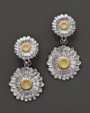 Blooming daises are detailed in 18K yellow gold accents on Buccellati's pendant earrings.