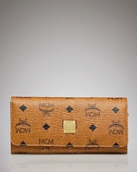 Give your riches the designer treatment with MCM's leather heritage wallet. The logo-stamped little number stores your essentials in luxe vintage style. Give your riches the designer treatment with MCM's leather heritage wallet. The logo-stamped little number stores your essentials in luxe vintage style.