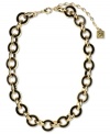 Link together haute fashion. This chunky collar necklace from Anne Klein flaunts jet enamel links for an intriguing look. Crafted in gold tone mixed metal. Approximate length: 16 inches + 3-inch extender.