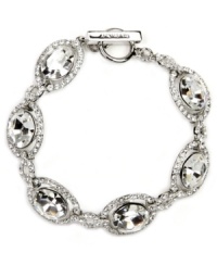 You've thought of every last detail, now for the finishing touches. The glamorous oval shape and subtly shimmering glass design of Givenchy's bridal bracelet make it the perfect piece for your special day. Crafted in silver-plated mixed metal. Approximate length: 7-1/4 inches. You've thought of every last detail, now for the finishing touches. The glamorous oval shape and subtly shimmering glass design of Givenchy's bridal bracelet make it the perfect piece for your special day. Crafted in silver-plated mixed metal. Approximate length: 7-1/4 inches.