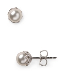 Silver set crystals surround lustrous simulated 6mm pearls to create a simply elegant silhouette. Wear this pair of Nadri stud earrings for have-forever glamour. Silver set crystals surround lustrous simulated 6mm pearls to create a simply elegant silhouette. Wear this pair of Nadri stud earrings for have-forever glamour.