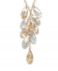 A sparkling array in rich tones will set your look off for an evening of ambiance. Swarovski's glistening gold tone mixed metal pendant elegantly combines Crystal Golden Shadow and clear crystal accents. Approximate length: 15 inches. Approximate drop: 2 inches. A sparkling array in rich tones will set your look off for an evening of ambiance. Swarovski's glistening gold tone mixed metal pendant elegantly combines Crystal Golden Shadow and clear crystal accents. Approximate length: 15 inches. Approximate drop: 2 inches.
