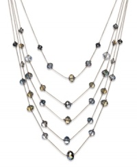 Find a sophisticated new level of style. This five-row illusion necklace by c.A.K.e by Ali Khan boasts opal-colored glass beads (10-12 mm). Set in gold tone mixed metal. Approximate length: 17 inches + 3-inch extender. Approximate drop: 6 inches. Find a sophisticated new level of style. This five-row illusion necklace by c.A.K.e by Ali Khan boasts opal-colored glass beads (10-12 mm). Set in gold tone mixed metal. Approximate length: 17 inches + 3-inch extender. Approximate drop: 6 inches.