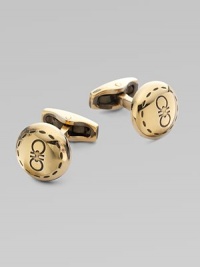 Round brass design engraved with iconic double gancini details, in a unique goldtone.BrassAbout ½ diam.Made in Italy Round brass design engraved with iconic double gancini details, in a unique goldtone.BrassAbout ½ diam.Made in Italy