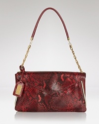 The power clutch is the bag we want now, and this embossed style from Badgley Mischka is an exotic take on the trend. A lined interior conceals an optional strap for over-the-shoulder wear. The power clutch is the bag we want now, and this embossed style from Badgley Mischka is an exotic take on the trend. A lined interior conceals an optional strap for over-the-shoulder wear.