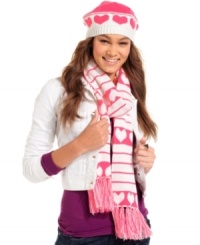 Get wrapped up in something warm and wonderful this winter with this cheery knit scarf from American Rag. Outfitted in pink hearts and stripes, you'll be cute and cozy all season long. Get wrapped up in something warm and wonderful this winter with this cheery knit scarf from American Rag. Outfitted in pink hearts and stripes, you'll be cute and cozy all season long.